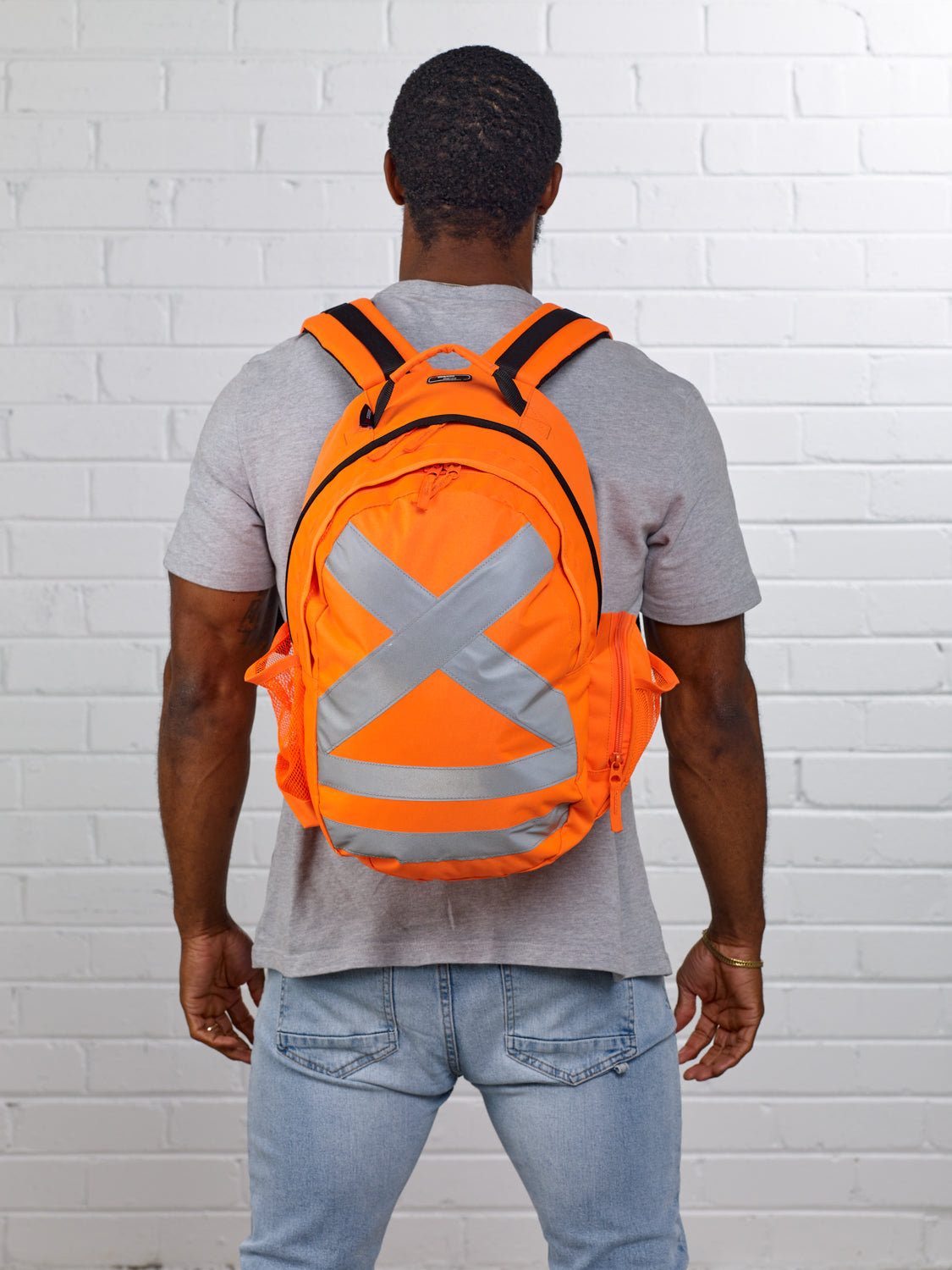 Caribee Calibre Safety backpack Orange - model shot on back